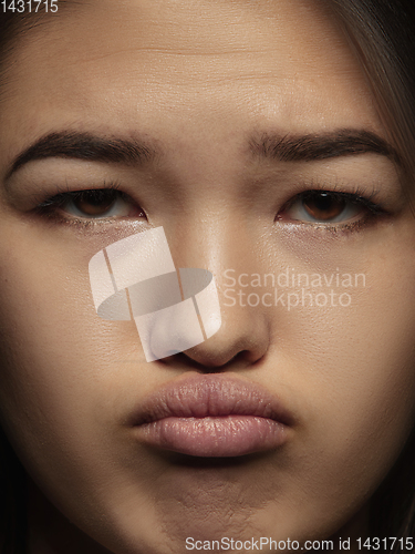 Image of Close up portrait of young emotional woman