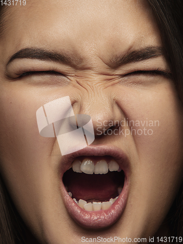 Image of Close up portrait of young emotional woman