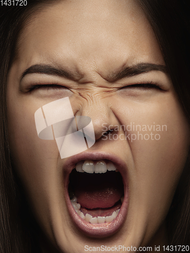 Image of Close up portrait of young emotional woman