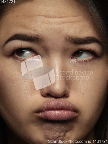 Image of Close up portrait of young emotional woman