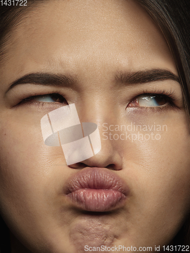 Image of Close up portrait of young emotional woman