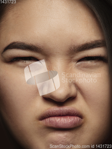 Image of Close up portrait of young emotional woman