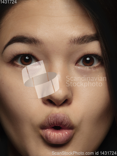 Image of Close up portrait of young emotional woman