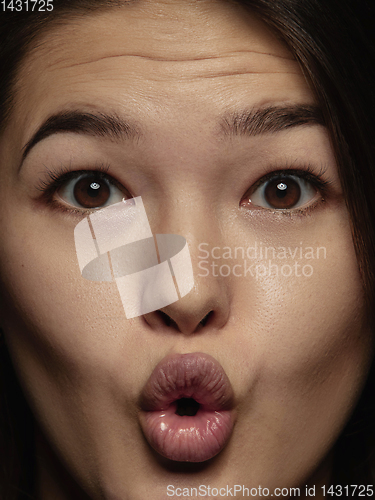 Image of Close up portrait of young emotional woman