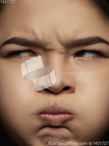 Image of Close up portrait of young emotional woman