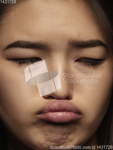 Image of Close up portrait of young emotional woman