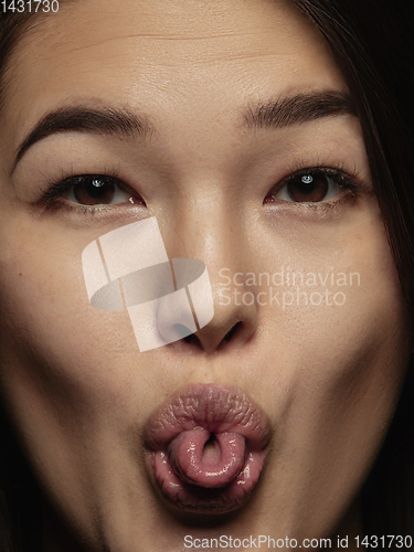Image of Close up portrait of young emotional woman