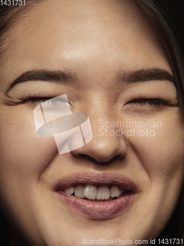 Image of Close up portrait of young emotional woman