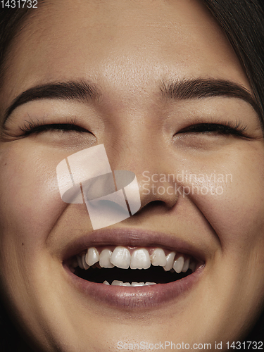 Image of Close up portrait of young emotional woman