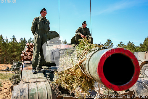 Image of Soldiers on tank in military training Saber Strike in Latvia.