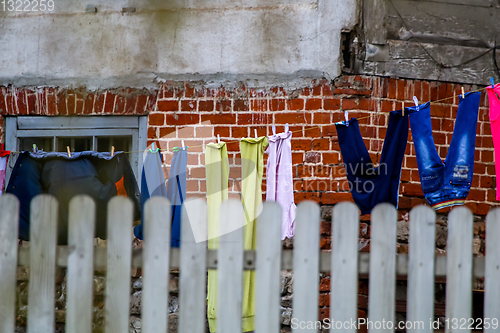 Image of Colorful clothes laundry drying outdoor.
