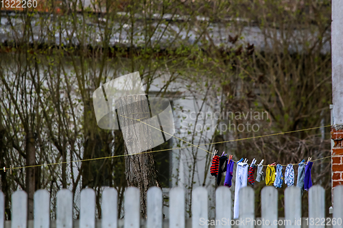 Image of Colorful clothes laundry drying outdoor.