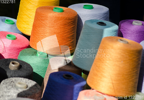 Image of Colorful thread spools as background.