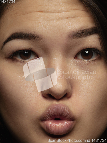 Image of Close up portrait of young emotional woman