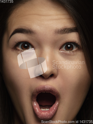 Image of Close up portrait of young emotional woman