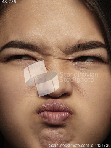 Image of Close up portrait of young emotional woman