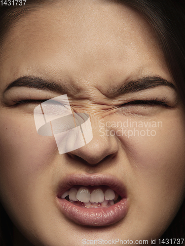 Image of Close up portrait of young emotional woman