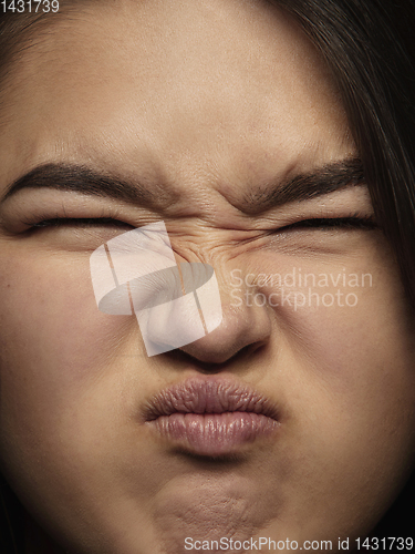 Image of Close up portrait of young emotional woman