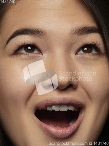 Image of Close up portrait of young emotional woman