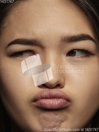 Image of Close up portrait of young emotional woman