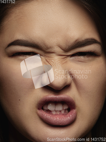 Image of Close up portrait of young emotional woman