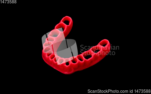 Image of model of human gums without teeth isolated on black