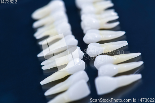 Image of White teeth on blue background