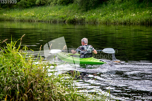 Image of People boating on river