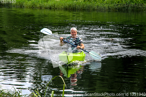 Image of People boating on river