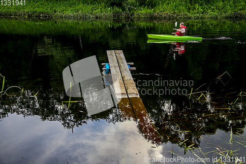 Image of People boating on river