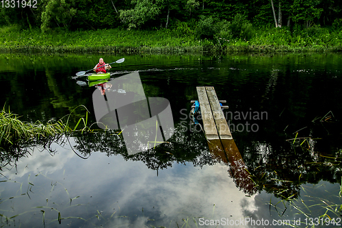 Image of People boating on river