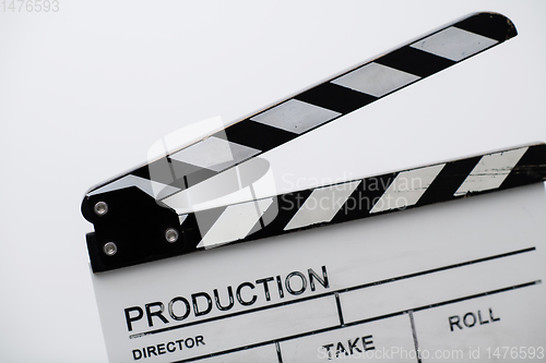 Image of movie clapper on white background