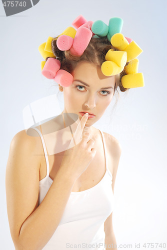 Image of A woman in hair curlers
