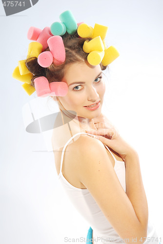 Image of A woman in hair curlers