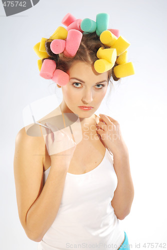 Image of A woman in hair curlers