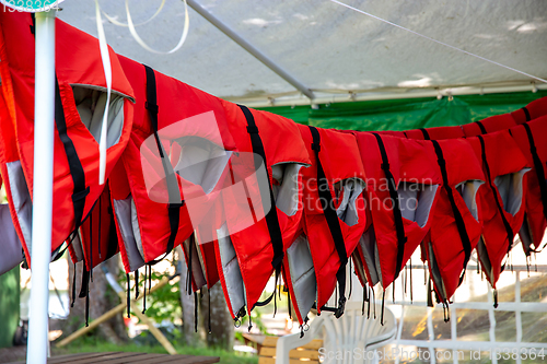 Image of Life jackets drying in the shed.