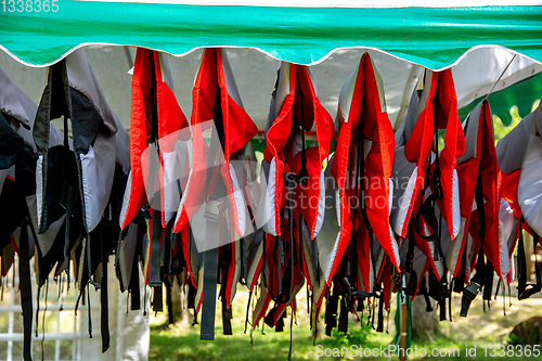 Image of Life jackets drying in the shed.