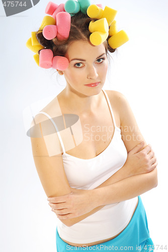 Image of A woman in hair curlers