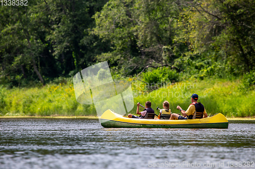 Image of Family in boat trip by boat on the river.
