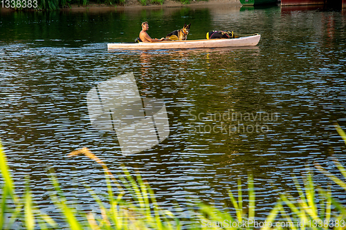 Image of Boat trip by boat on the river with dog.