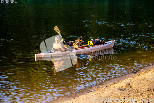 Image of Boat trip by boat on the river with dog.