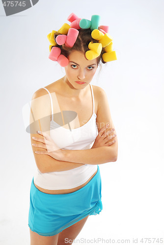 Image of A woman in hair curlers