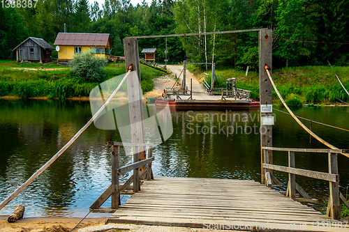 Image of Ferry crossing on the bank of river.