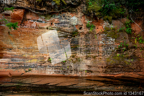 Image of Red sandstone cliff near the river.