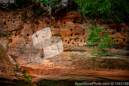 Image of Red sandstone cliff near the river.