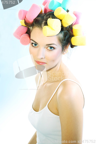 Image of A woman in hair curlers