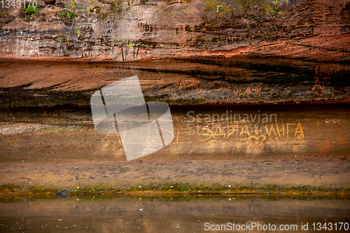 Image of Red sandstone cliff near the river.