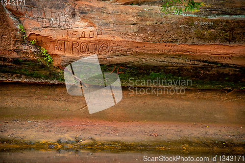 Image of Red sandstone cliff near the river.