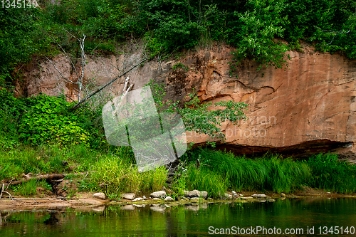 Image of Red sandstone cliff on coast of the river 