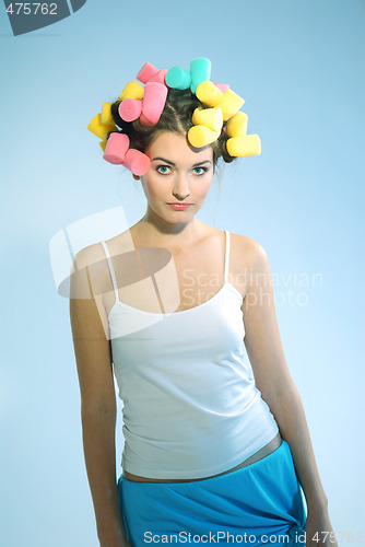 Image of A woman in hair curlers